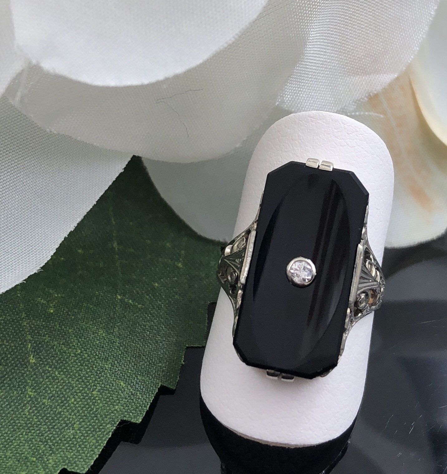 Estate Piece - 18k yellow gold onyx and diamond ring